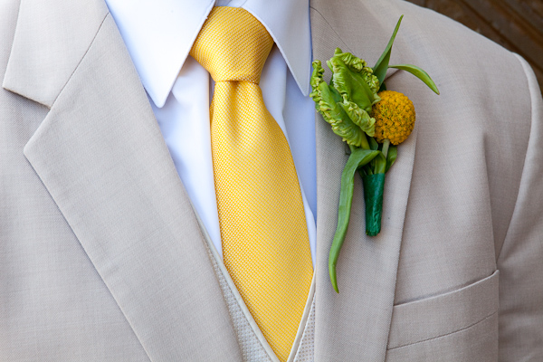 gray suit with yellow tie